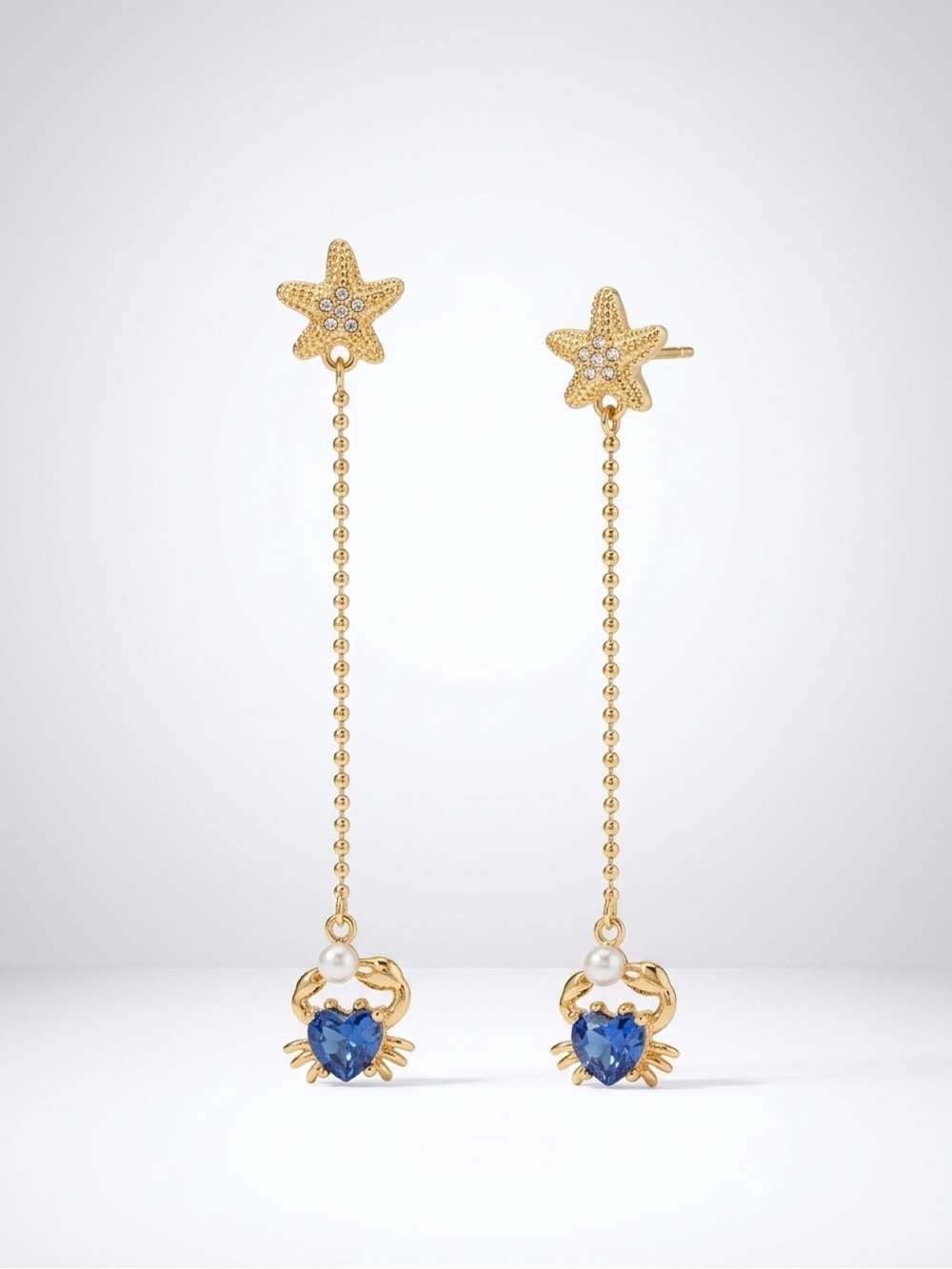 kate spade gold-tone starfish drop earrings with blue heart crab charms